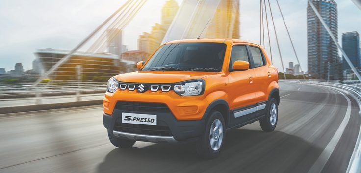 Orange Suzuki S-Presso on a bridge