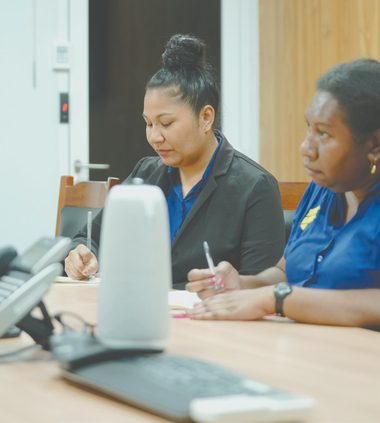 First Investment Finance staff discussing client work