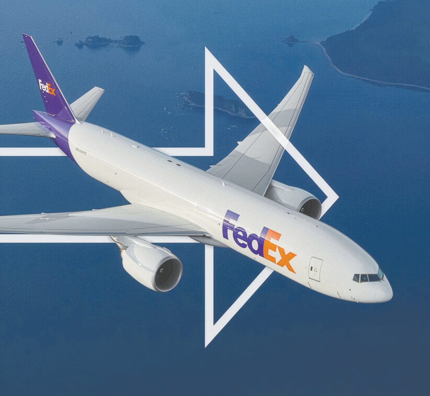 FedEx cargo aircraft in flight over the ocean